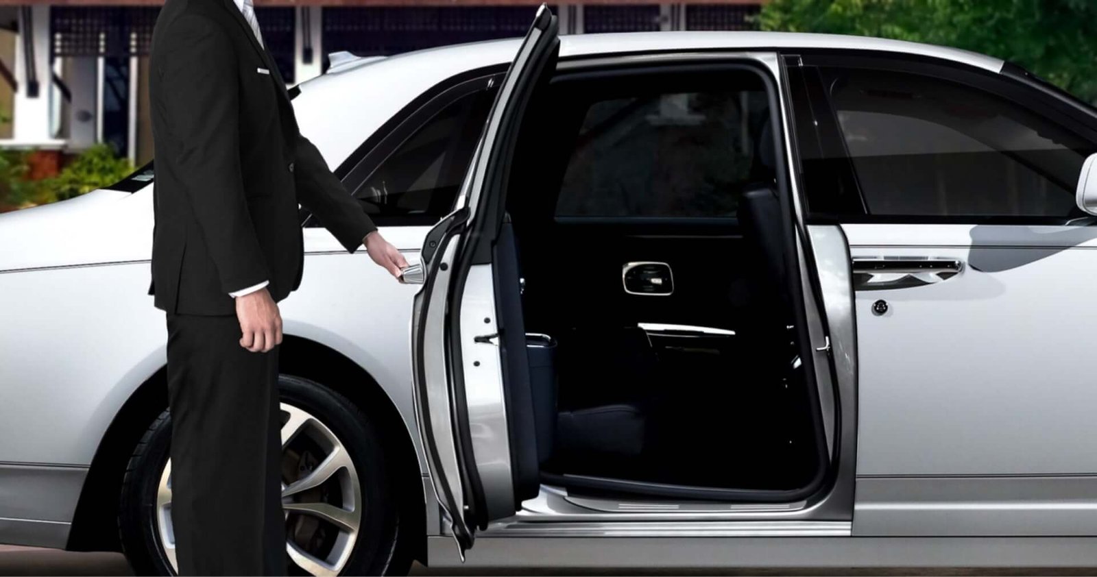 Chauffeur opening the door of a luxury car for American Car Service New Jersey.
